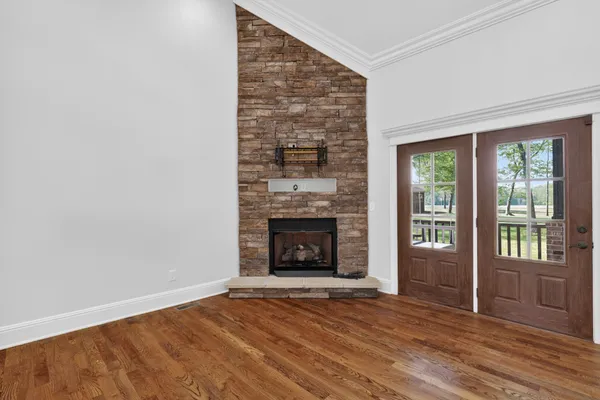 a view of livingroom with hardwood floor and a ceiling fan