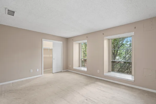 a bathroom with a sink a mirror and a shower