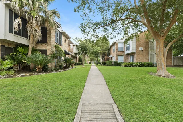 a view of swimming pool with a yard
