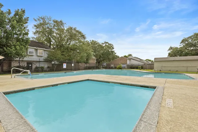 a view of a house with a swimming pool