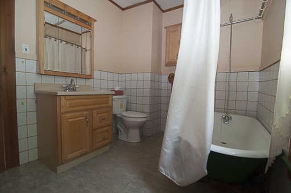 4 Shaw Street Medway, MA 02053 - Photo 14 of 25 a bathroom with a granite countertop sink toilet and shower