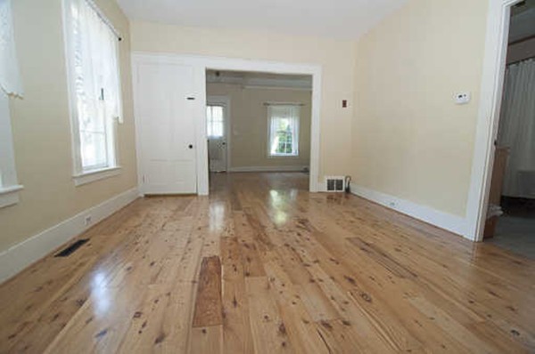 4 Shaw Street Medway, MA 02053 - Photo 15 of 25 a view of an empty room with wooden floor and a window