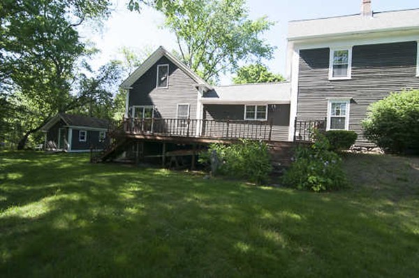 4 Shaw Street Medway, MA 02053 - Photo 20 of 25 a front view of a house with a yard and trees