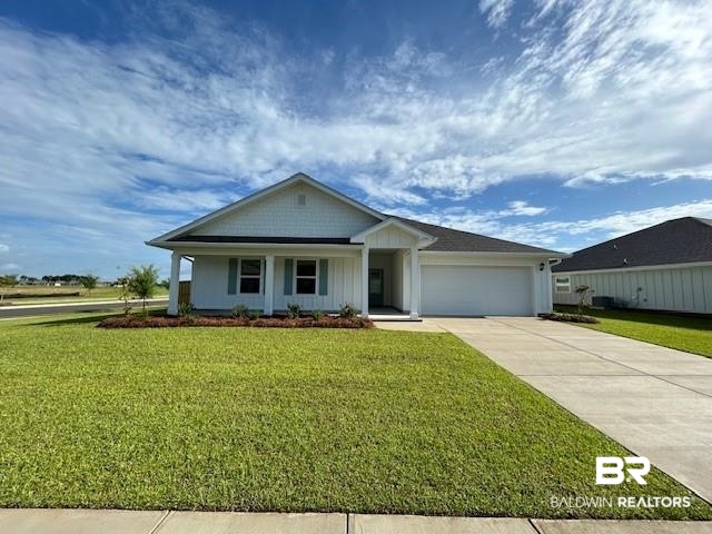 22195 Early Dawn Circle Foley, AL 36535 - Photo 1 of 1 View of front of house with a garage and a front lawn