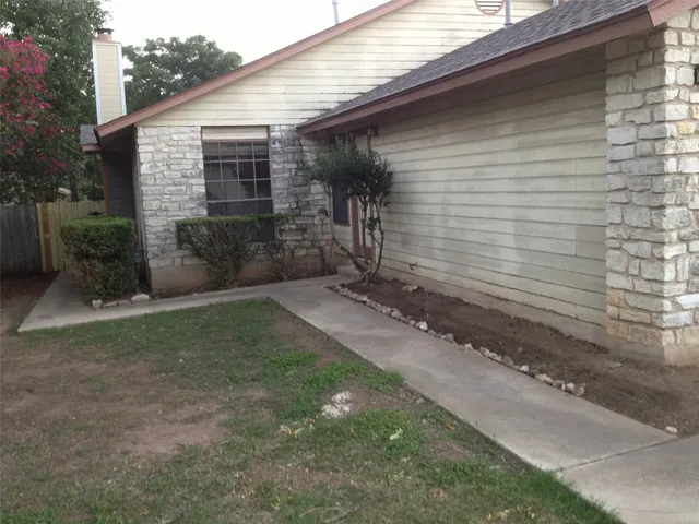 a view of a back yard of the house