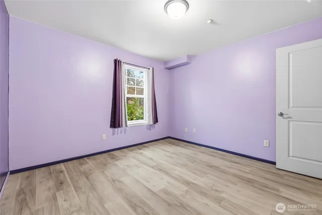 a view of a livingroom with wooden floor