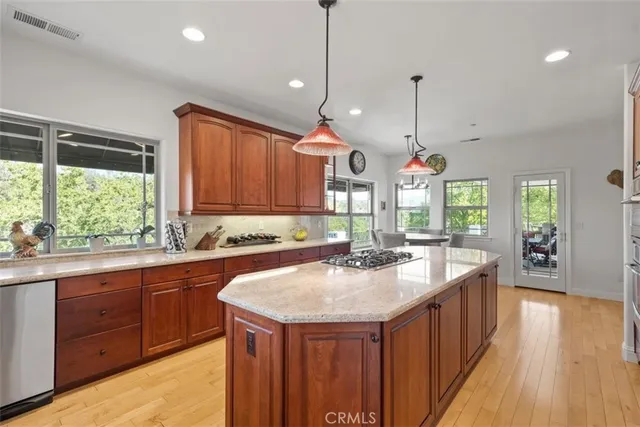a living room with fireplace furniture and a large window