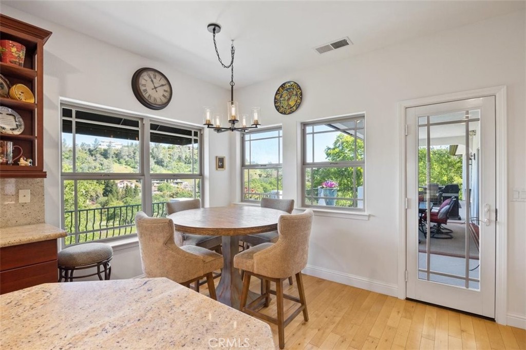 3217 Shallow Springs Terrace Chico, CA 95928 - Photo 17 of 55 a view of a dining room with furniture window and wooden floor