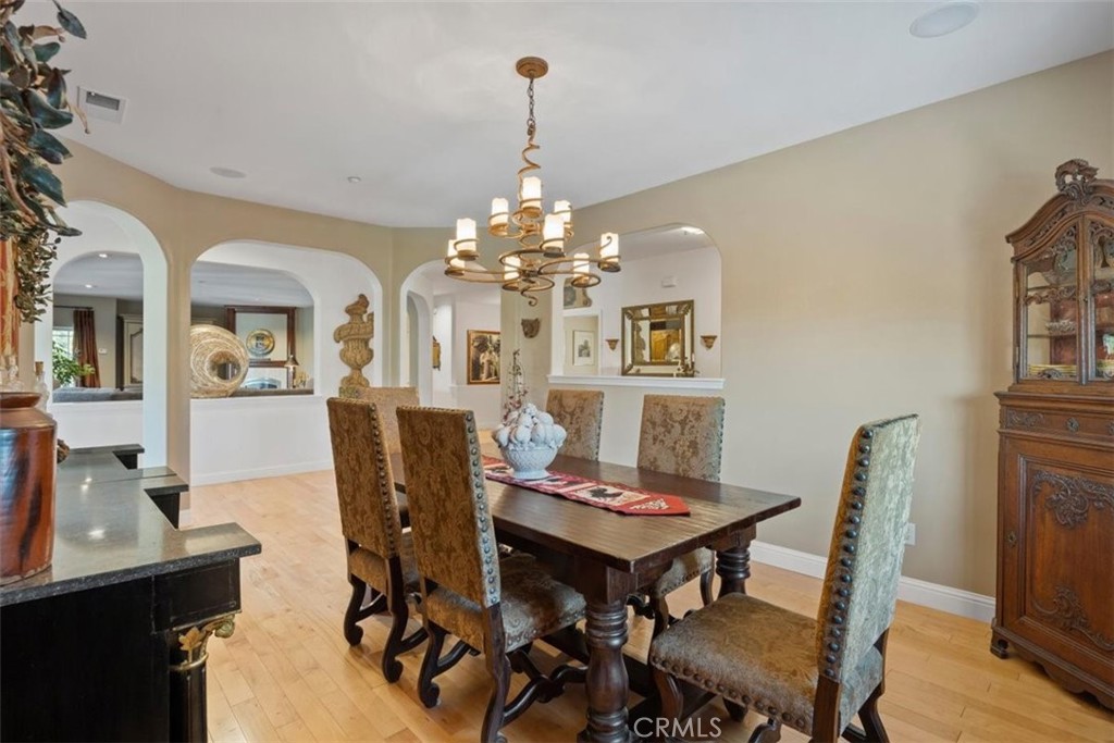 3217 Shallow Springs Terrace Chico, CA 95928 - Photo 20 of 55 a view of a dining room with furniture and chandelier