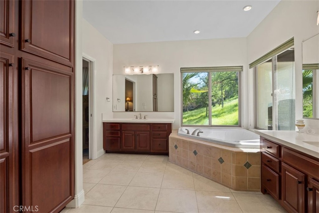 3217 Shallow Springs Terrace Chico, CA 95928 - Photo 29 of 55 a large bathroom with a large tub shower and sink