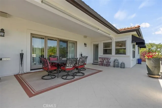 a living room with furniture a window and gym equipment