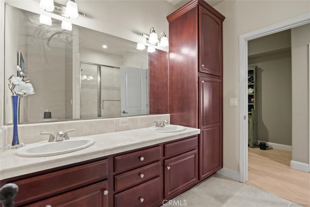 3217 Shallow Springs Terrace Chico, CA 95928 - Photo 43 of 55 a bathroom with a granite countertop sink and a mirror