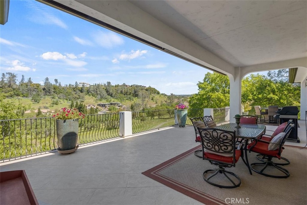 3217 Shallow Springs Terrace Chico, CA 95928 - Photo 48 of 55 a view of a city from a dining room with large windows