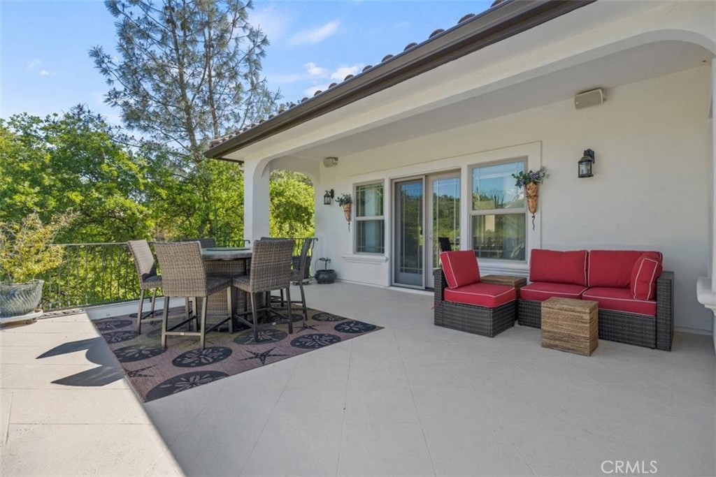 3217 Shallow Springs Terrace Chico, CA 95928 - Photo 53 of 55 a view of a patio with couple of chairs and potted plants