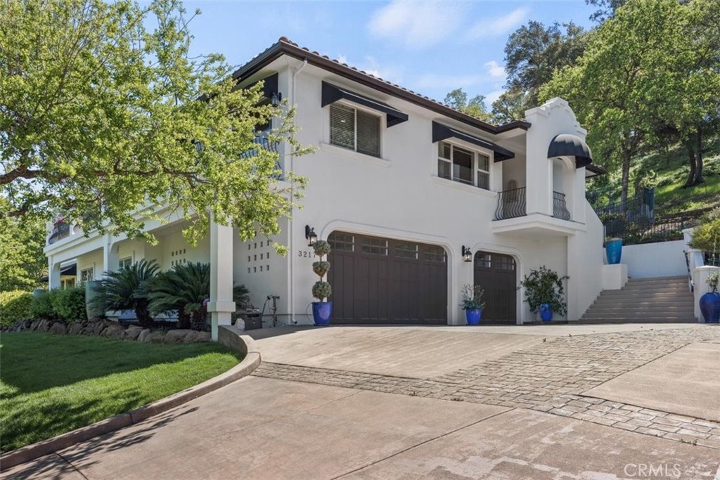 3217 Shallow Springs Terrace Chico, CA 95928 - Photo 8 of 55 a front view of a house with a yard and garage