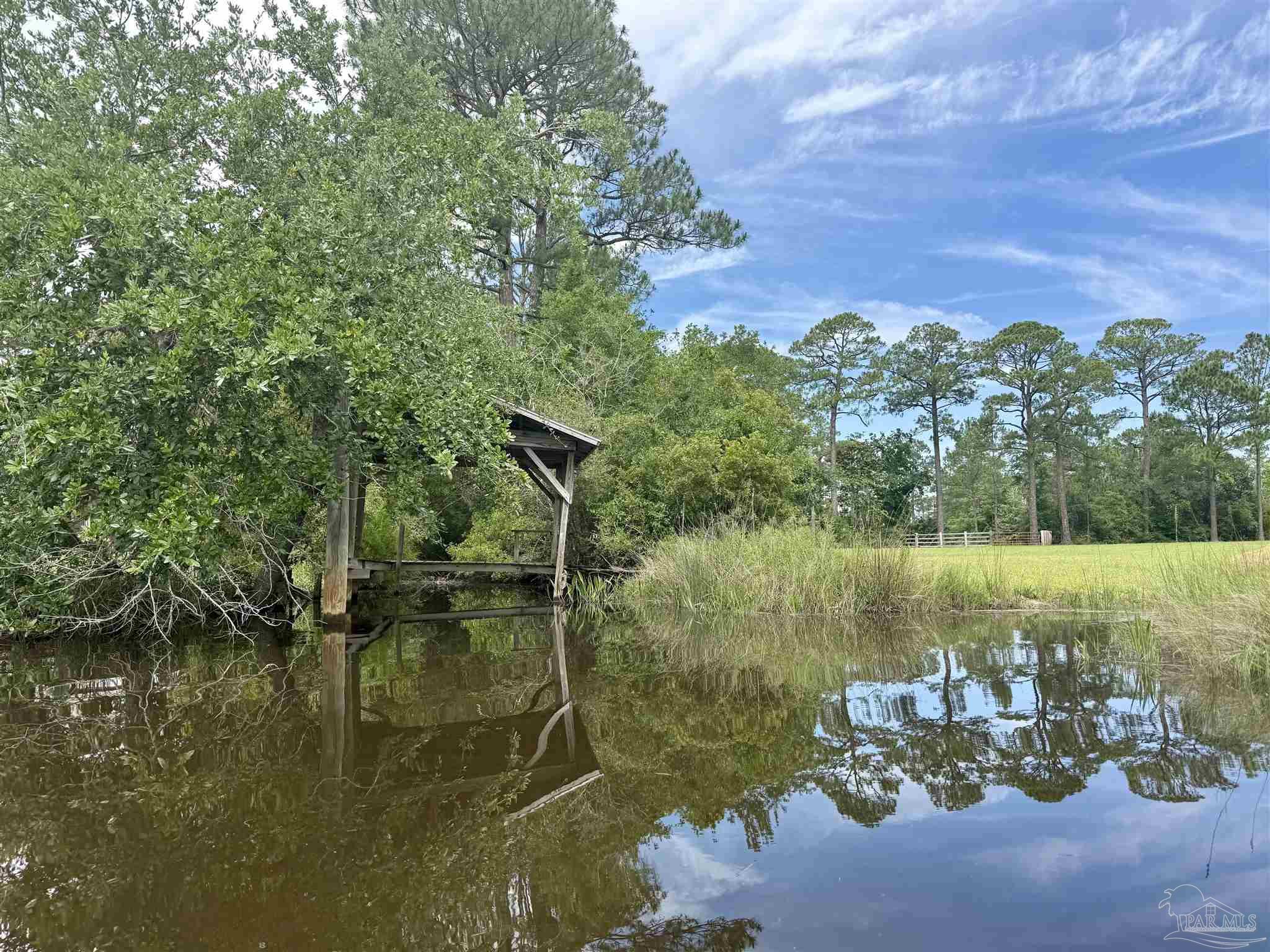 7524 Petersen Point Road Milton, FL 32583 - Photo 14 of 26 a view of a lake from a yard