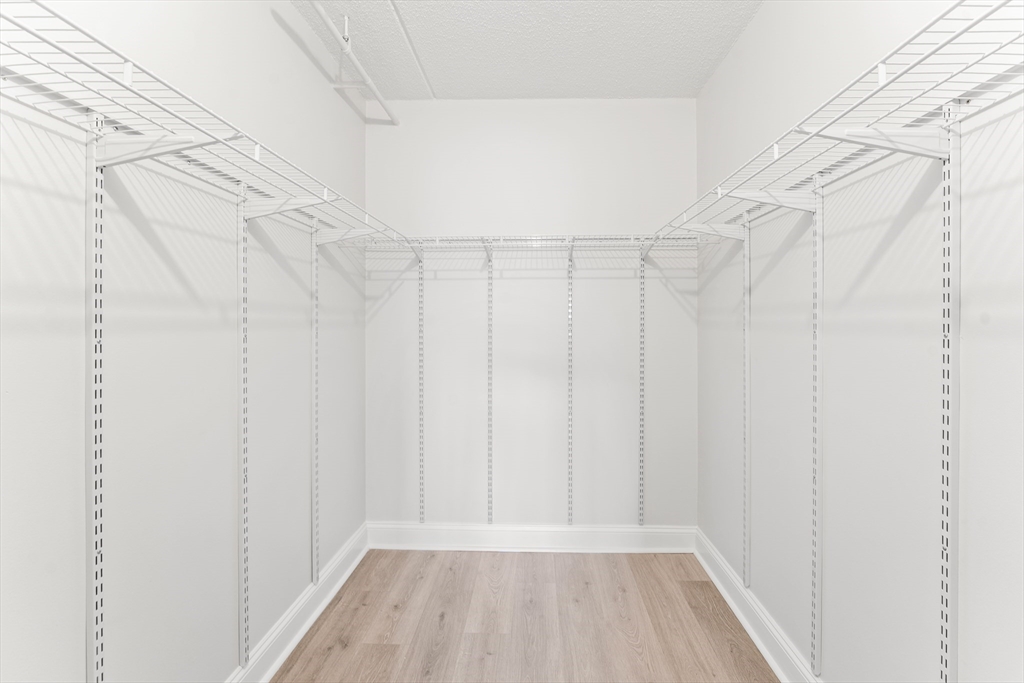 275 Main Street, Unit 404 Watertown, MA 02472 - Photo 31 of 39 a view of a room with racks on the wall