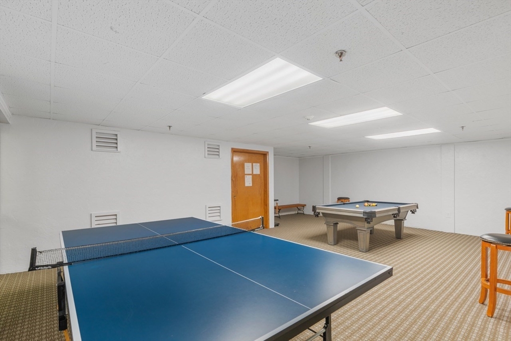 275 Main Street, Unit 404 Watertown, MA 02472 - Photo 35 of 39 a view of a dining room with furniture and wooden floor