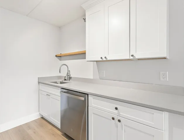a kitchen with a refrigerator stove and microwave