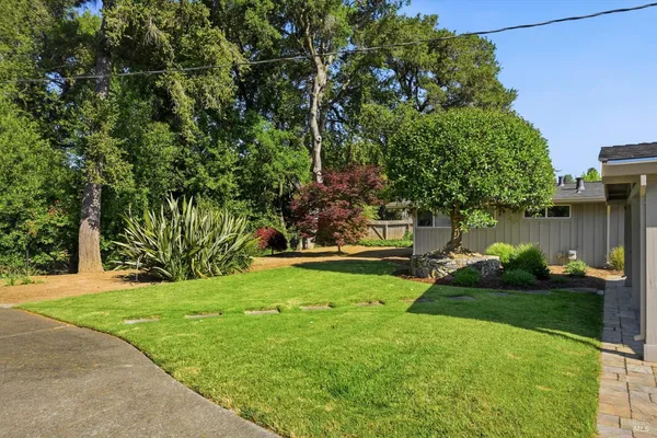 a backyard of a house with lots of green space