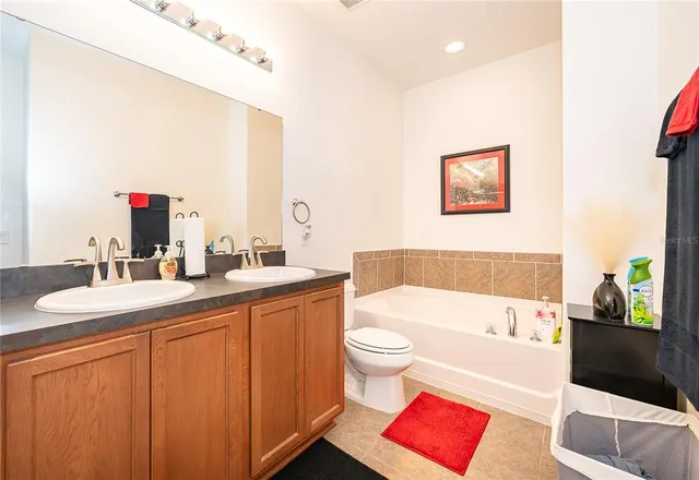 a bathroom with a toilet a sink and a bathtub