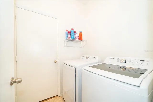 a utility room with dryer and washer