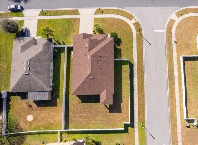 a aerial view of a house with swimming pool