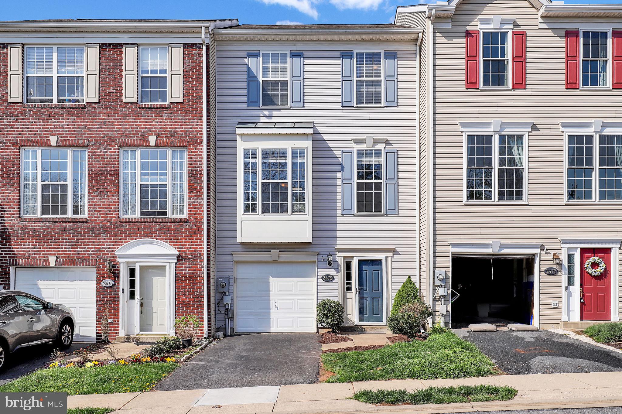 2475 Lakeside Drive Frederick, MD 21702 - Photo 1 of 40 a front view of a house with yard and parking