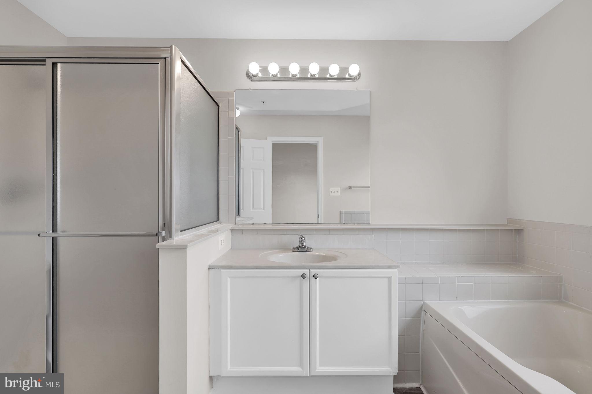 2475 Lakeside Drive Frederick, MD 21702 - Photo 16 of 40 a bathroom with a sink and a mirror