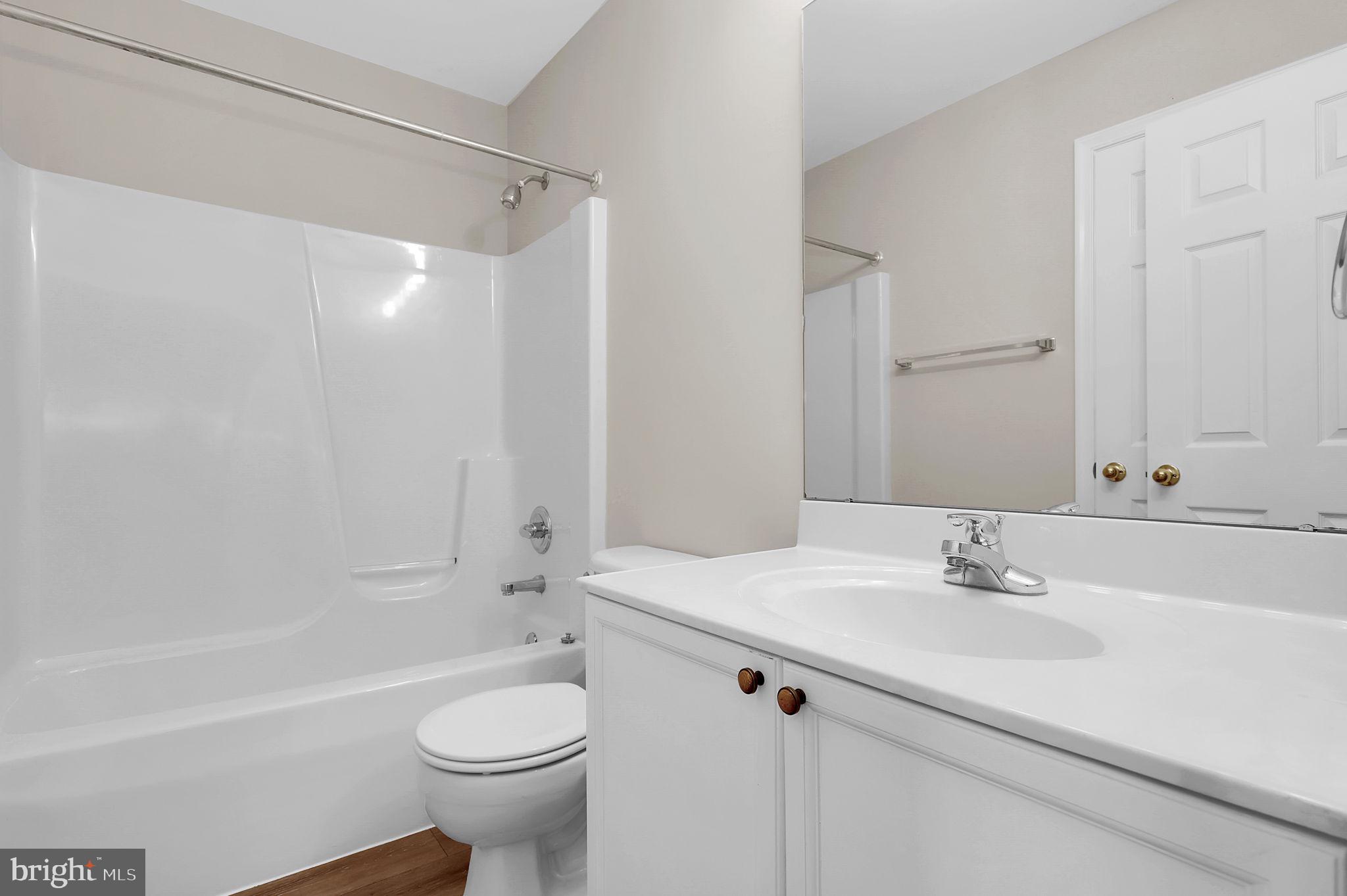 2475 Lakeside Drive Frederick, MD 21702 - Photo 18 of 40 a bathroom with a sink toilet and shower