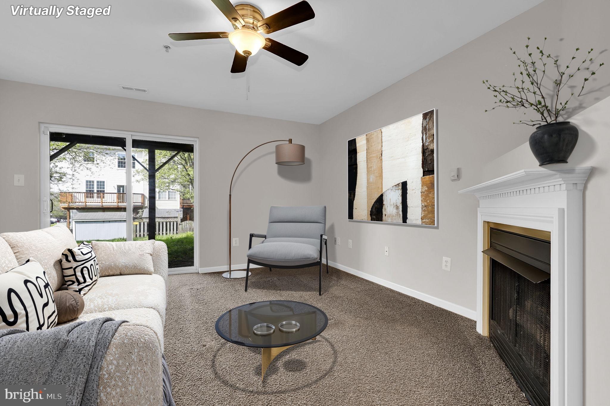 2475 Lakeside Drive Frederick, MD 21702 - Photo 19 of 40 a living room with furniture and a fireplace