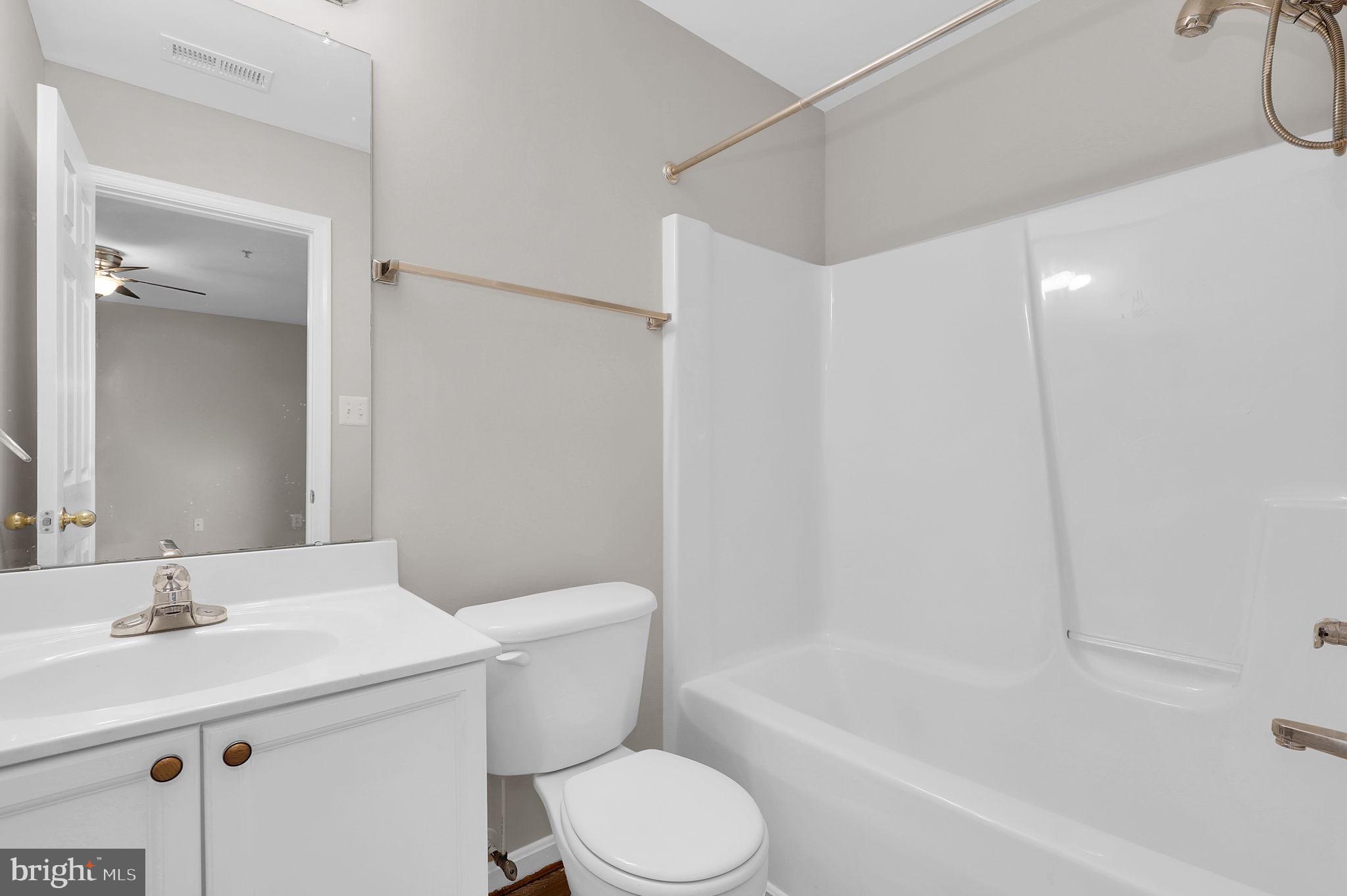 2475 Lakeside Drive Frederick, MD 21702 - Photo 20 of 40 a bathroom with a sink toilet and shower