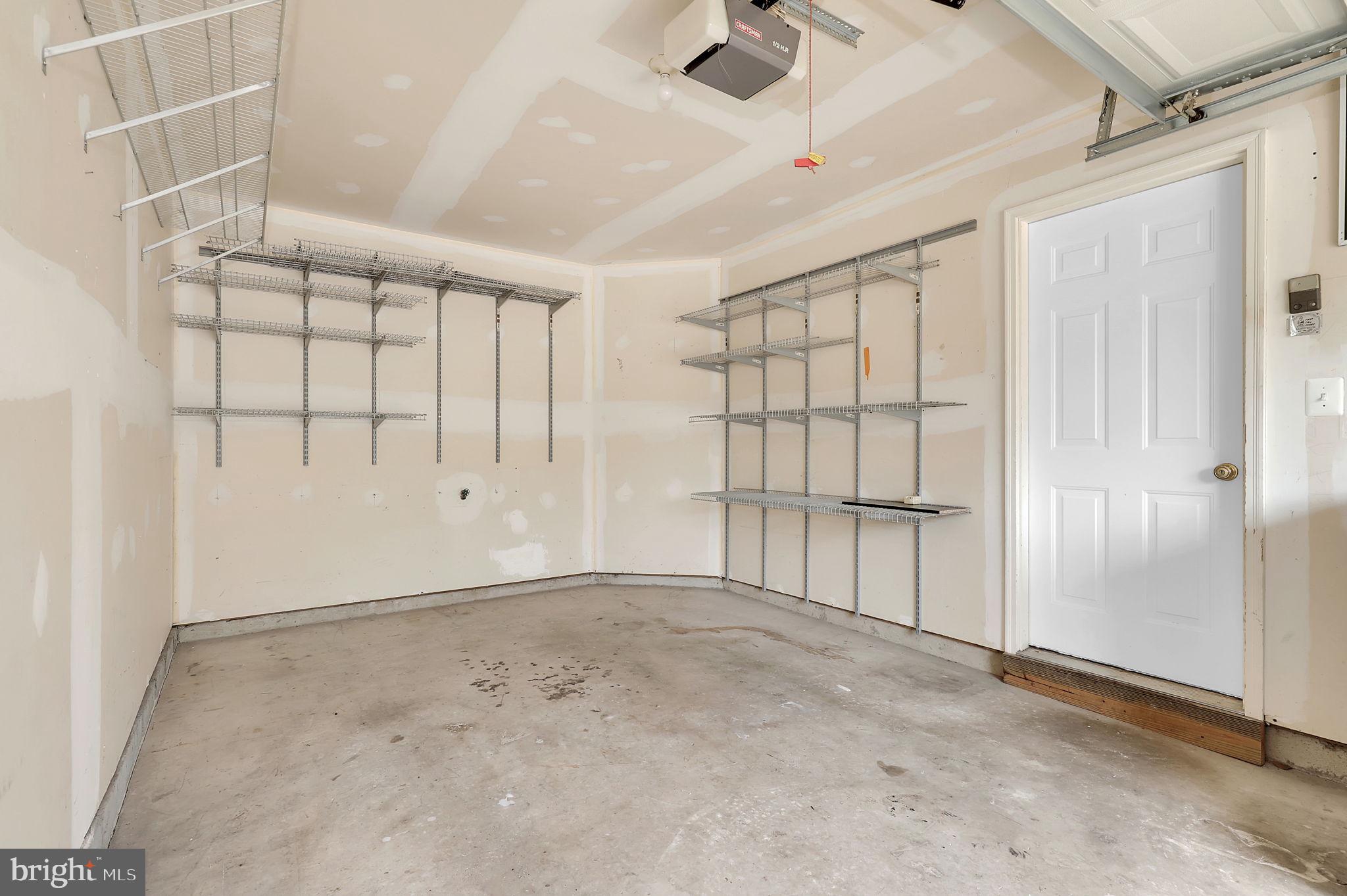 2475 Lakeside Drive Frederick, MD 21702 - Photo 23 of 40 an empty room with windows & cabinet