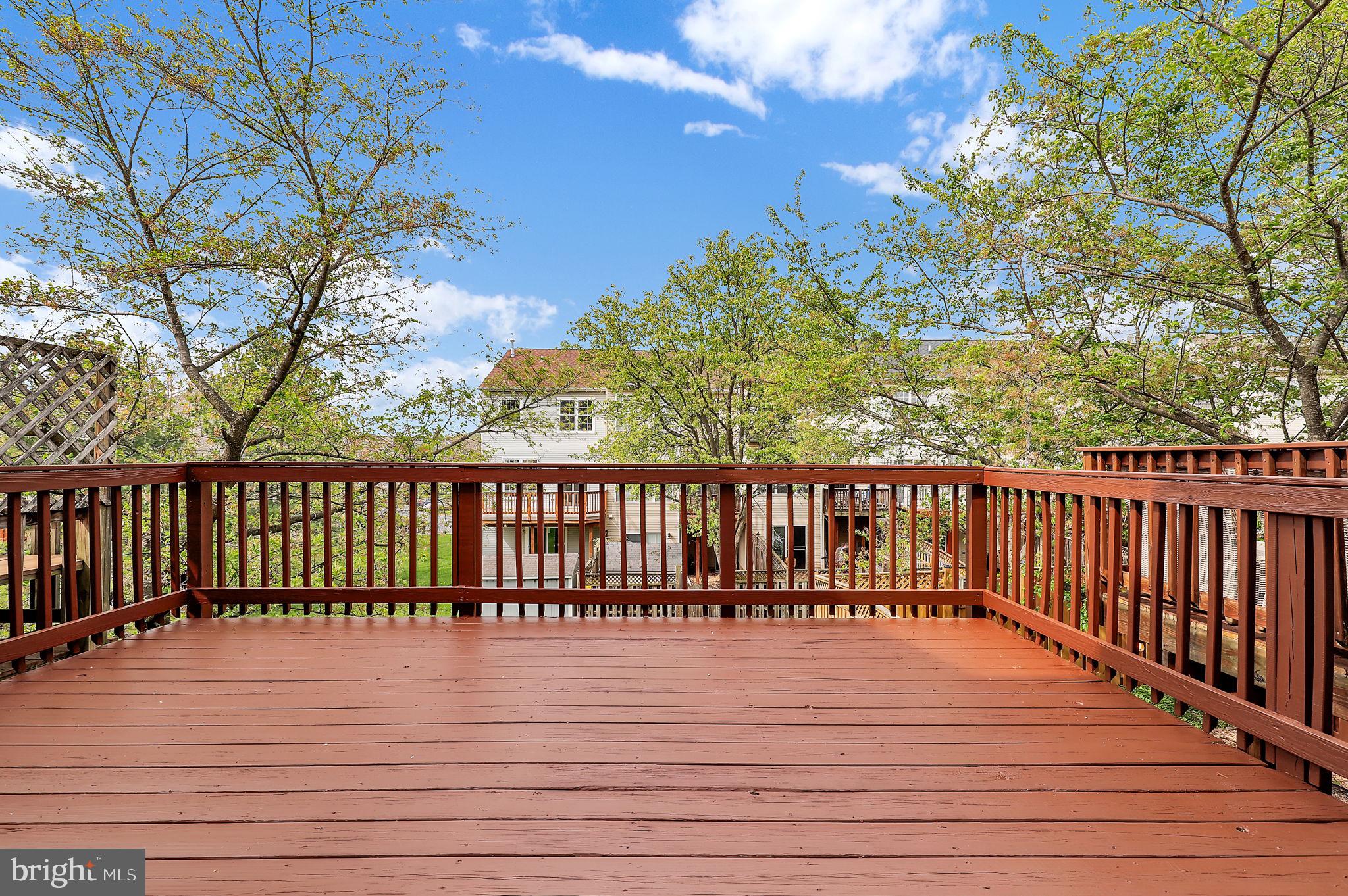 2475 Lakeside Drive Frederick, MD 21702 - Photo 24 of 40 a balcony with wooden floor and fence