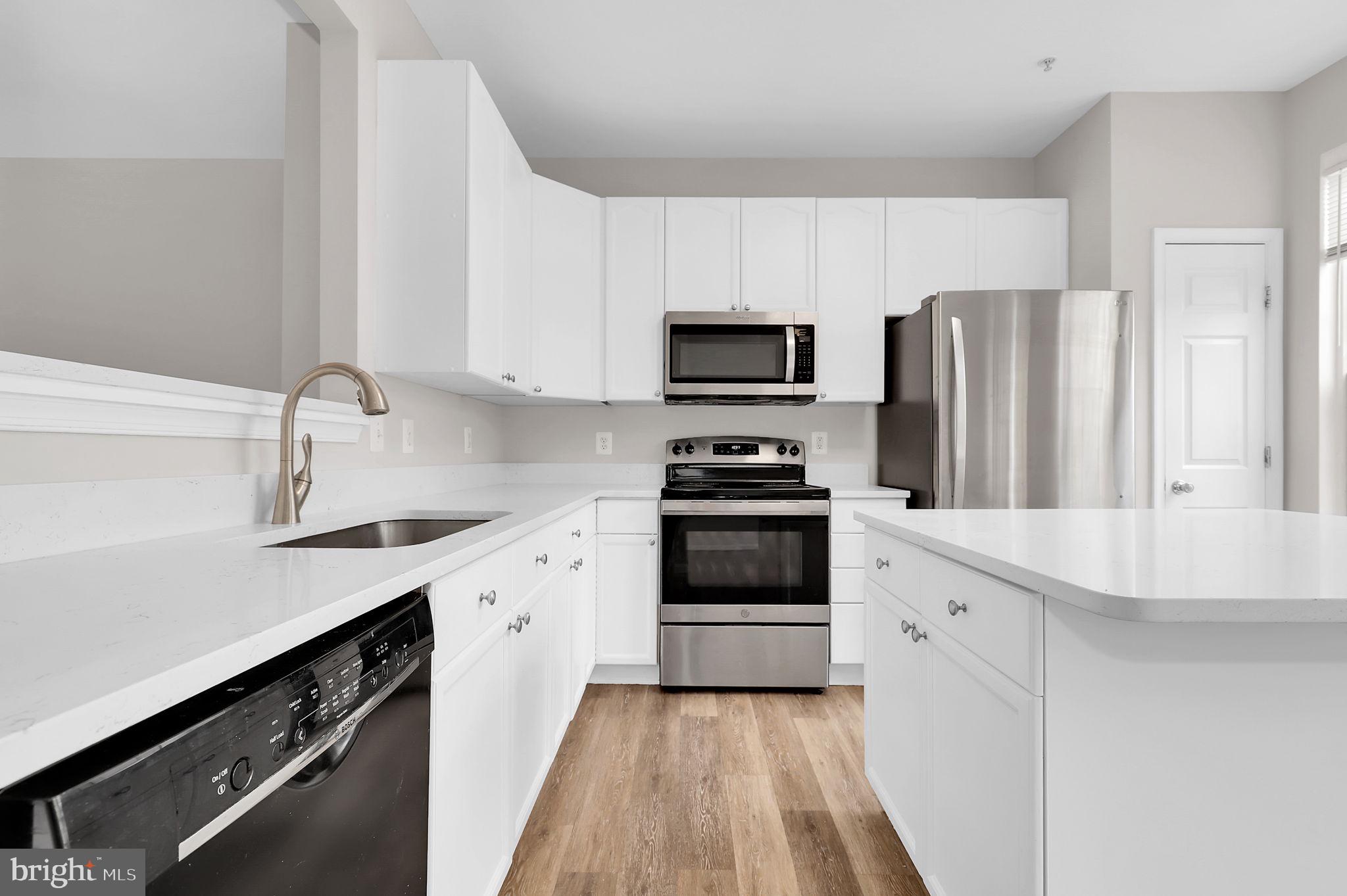 2475 Lakeside Drive Frederick, MD 21702 - Photo 6 of 40 a kitchen with stainless steel appliances a sink cabinets and a refrigerator