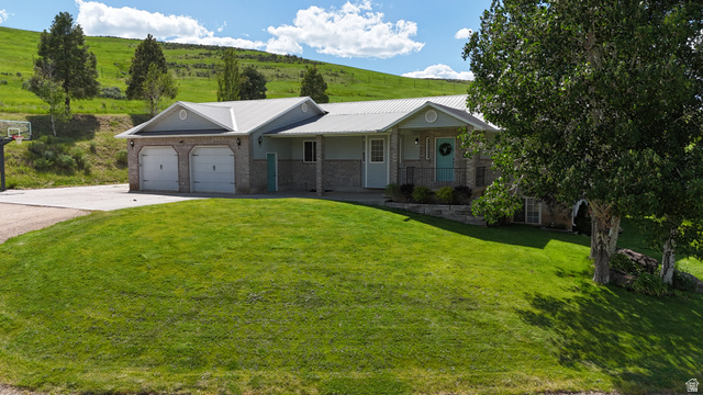 9029 North Treasureton Road Preston, ID 83263 - Photo 22 of 31 Ranch-style residence featuring a metal roof and stone veneer accents