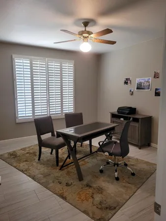 a workspace with furniture and a window
