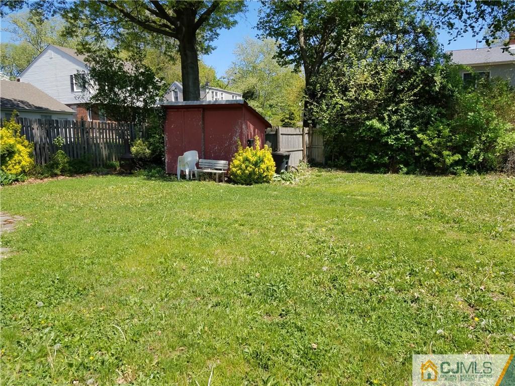 68 3rd Street Edison, NJ 08837 - Photo 12 of 13 a view of a house with a yard and sitting area