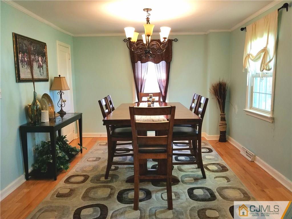 68 3rd Street Edison, NJ 08837 - Photo 5 of 13 a view of a dining room with furniture and wooden floor