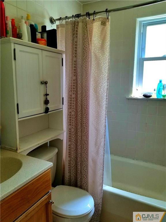 68 3rd Street Edison, NJ 08837 - Photo 7 of 13 a bathroom with a toilet and a shower