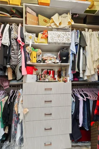 a bathroom with a sink a toilet a shower and a mirror