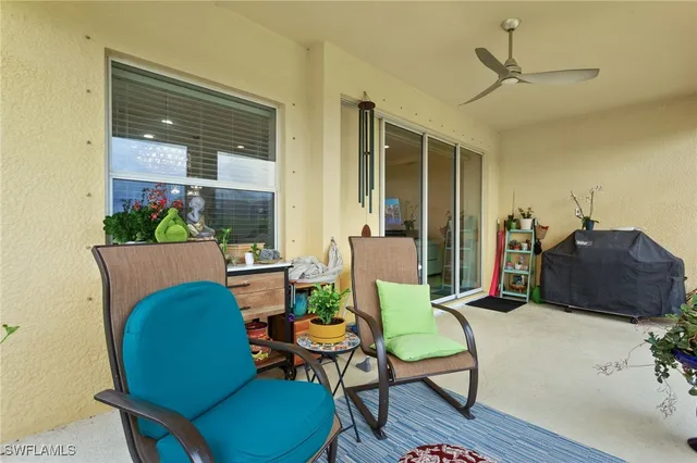 a white house with a big yard and large tree