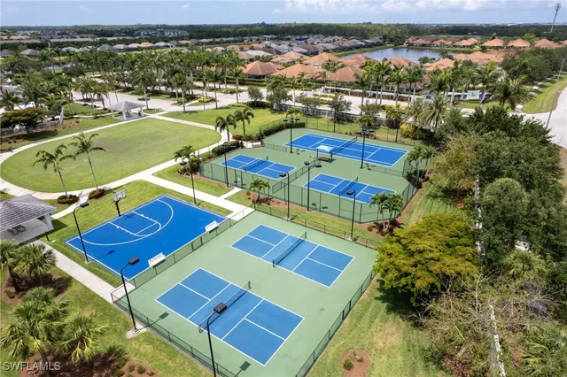 an aerial view of multiple houses with yard