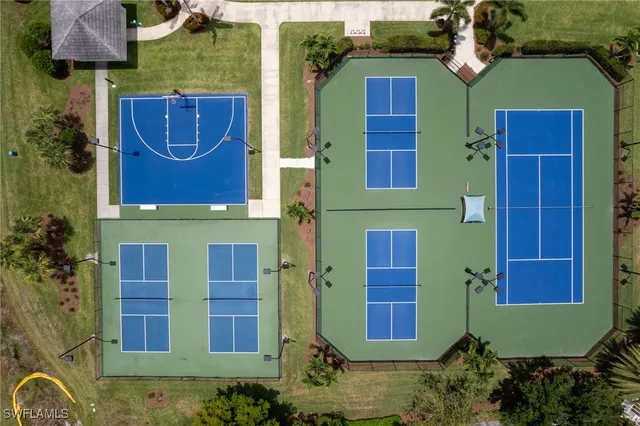 an aerial view of residential houses with outdoor space