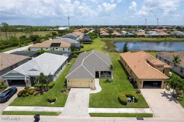an aerial view of multiple houses with yard