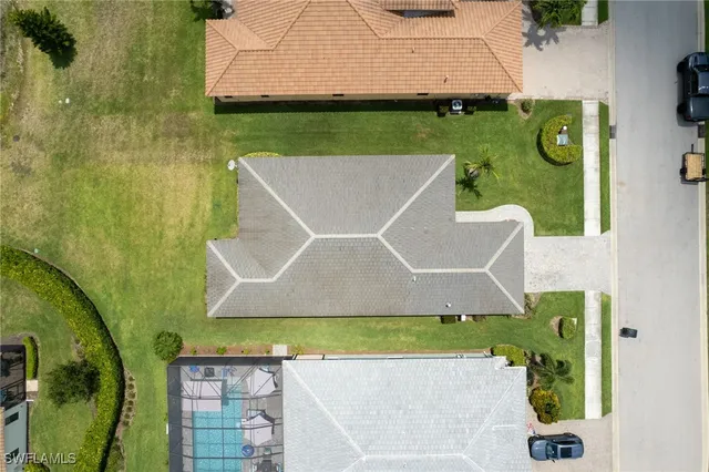 an aerial view of residential building and lake