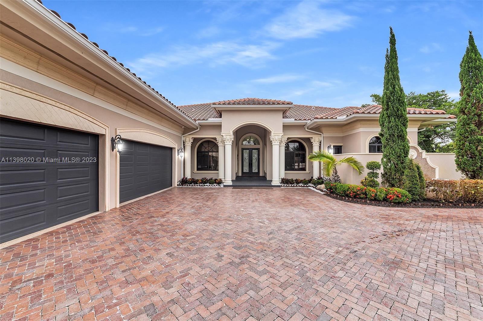 731 Ranch Road Weston, FL 33326 - Photo 1 of 53 a view of a house with a yard and potted plants