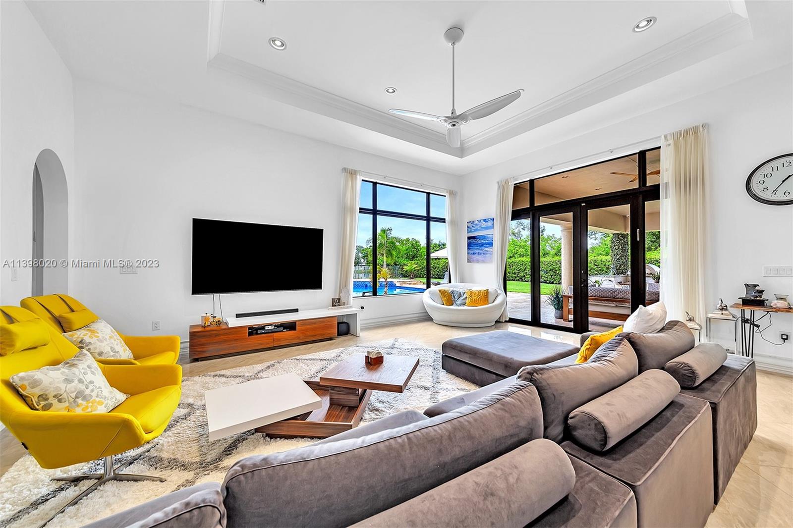731 Ranch Road Weston, FL 33326 - Photo 12 of 53 a living room with furniture and a flat screen tv