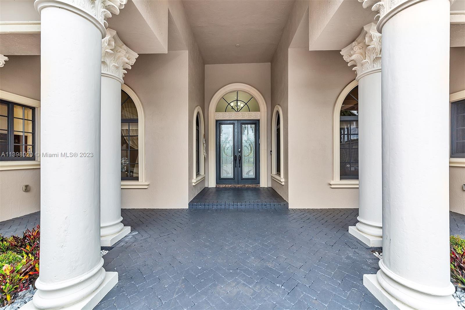 731 Ranch Road Weston, FL 33326 - Photo 2 of 53 a view of an entryway with wooden floor
