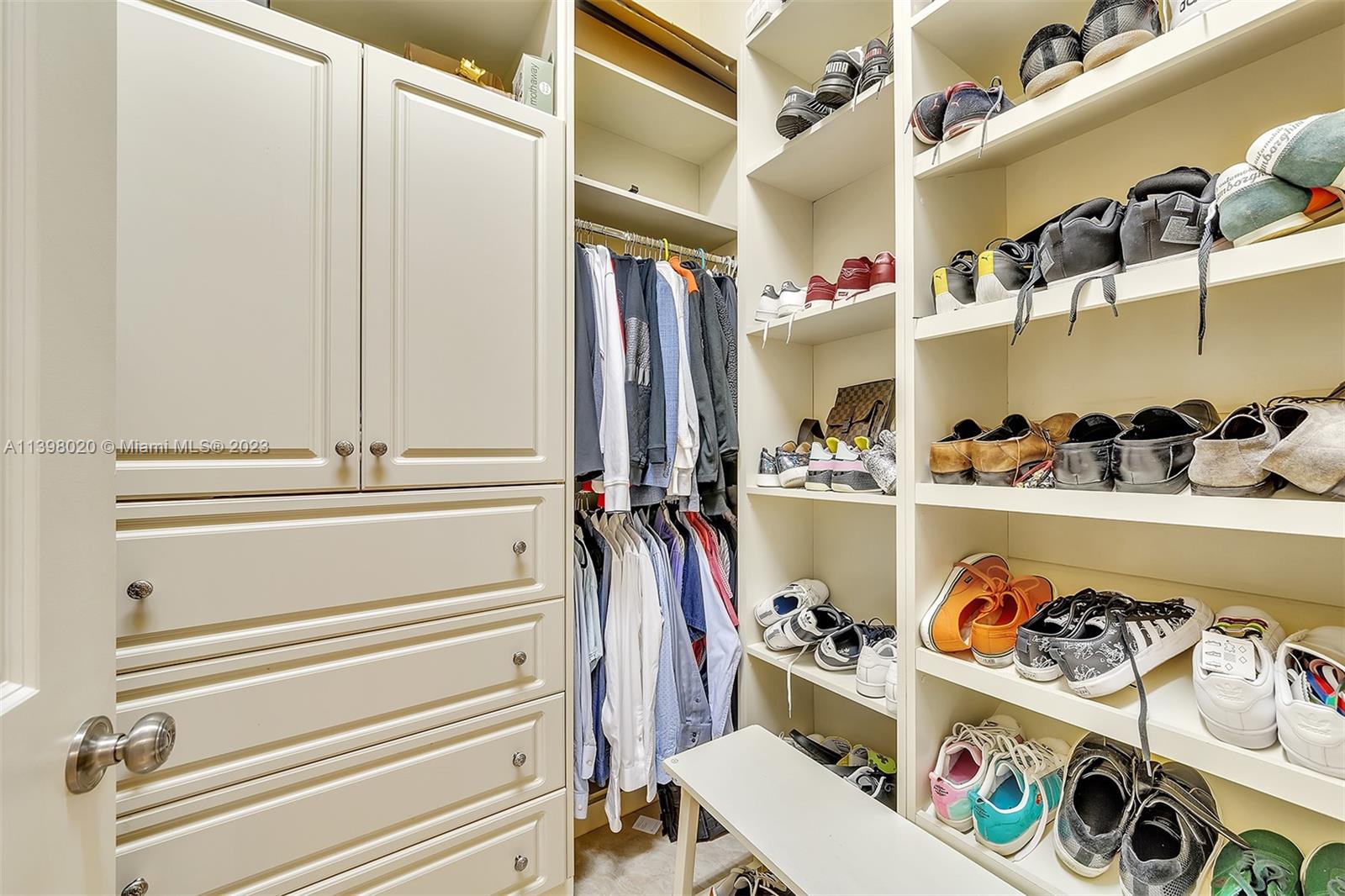 731 Ranch Road Weston, FL 33326 - Photo 22 of 53 a view of walk in closet with clothes and shoes